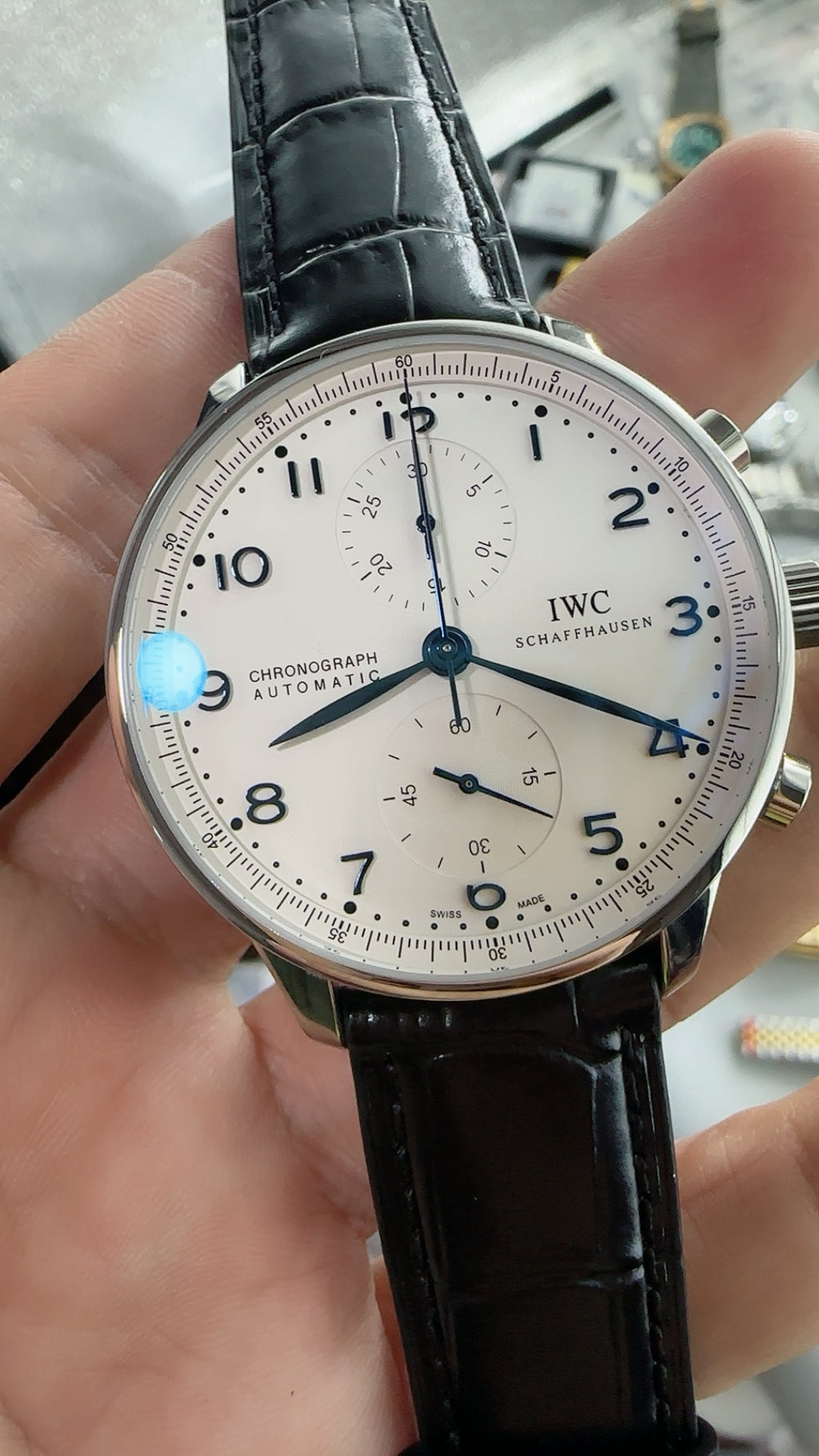 IWC Portugieser Chronograph IW371605 | 41MM | ตัวเรือนสเตนเลสสตีล | หน้าปัดสีขาว | เข็มสีน้ำเงิน | สายหนังจระเข้สีดำ | กลไกอัตโนมัติ Cal.69355