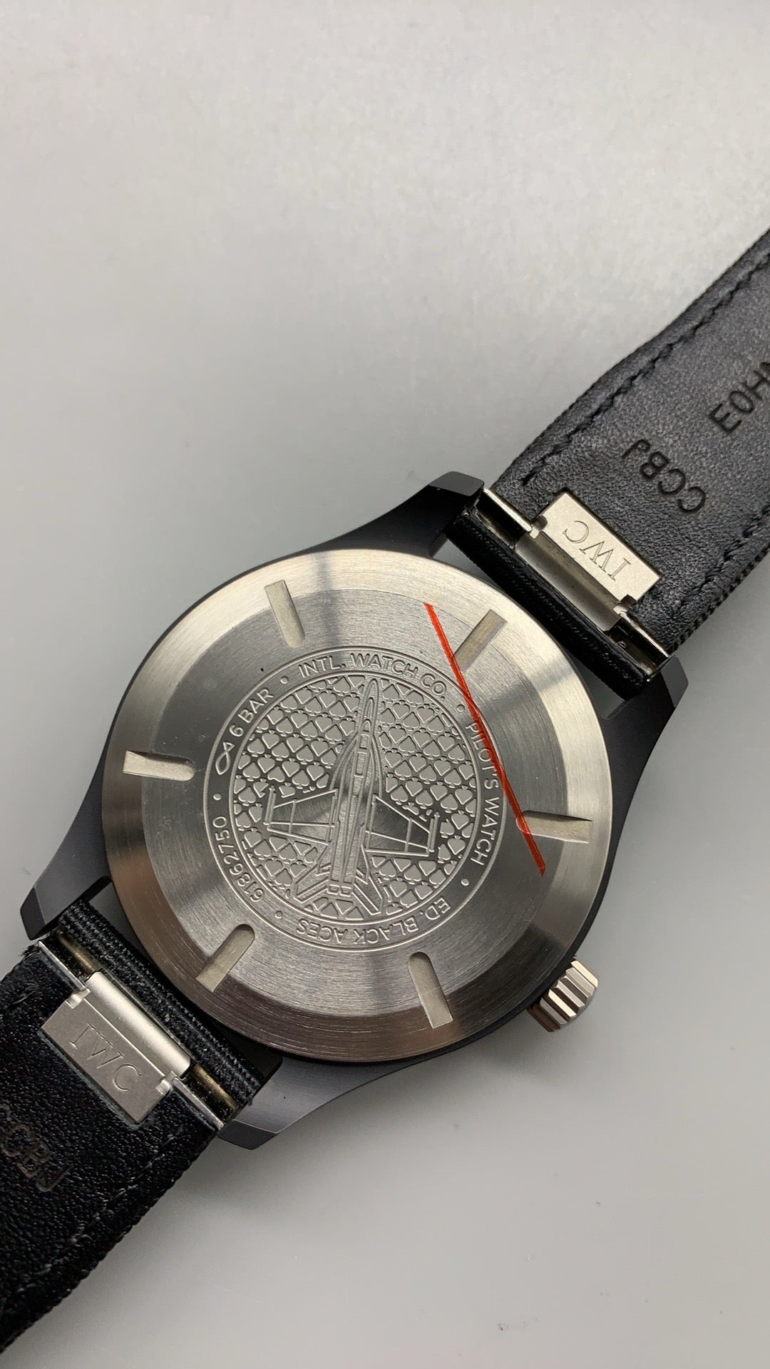 IWC Pilot's Watch Automatic Black Aces | 41MM | ตัวเรือนเซรามิกสีดำ | หน้าปัดสีขาวพิมพ์โลโก้ Black Aces | สายผ้า NATO สีดำ | กลไกอัตโนมัติ Cal.32100