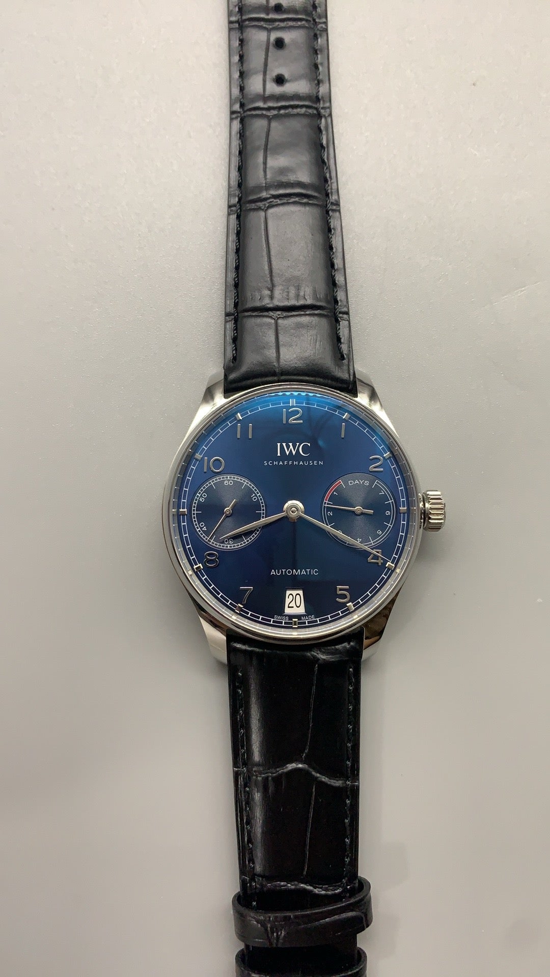 IWC Portugieser Automatic 7 Days | 42.3MM | ตัวเรือนสแตนเลสสตีล | พลังงานสำรอง 7 วัน | หน้าปัดสีน้ำเงิน | สายหนังจระเข้สีดำ | กลไกอัตโนมัติ Cal.52010